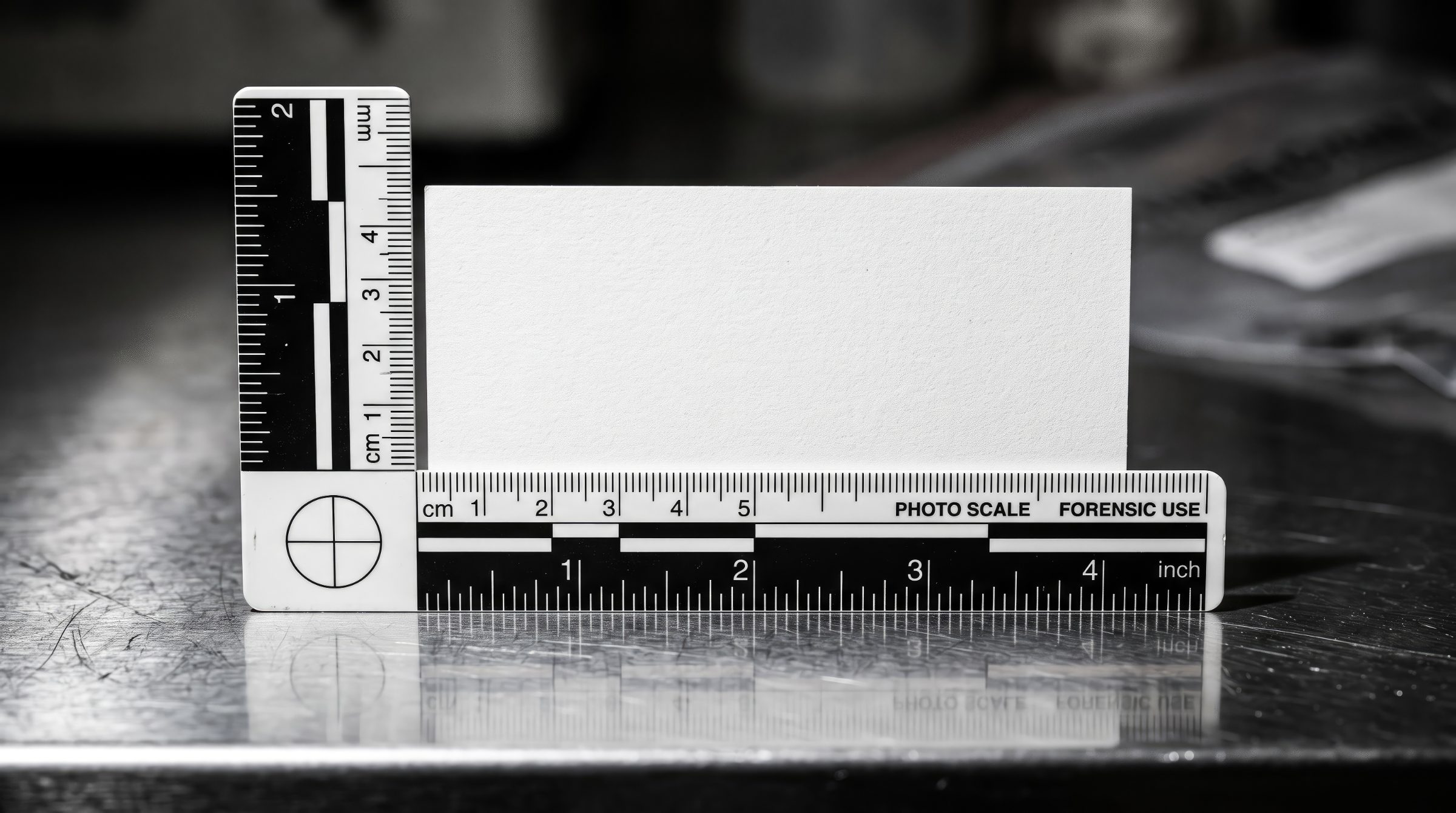 Forensic photo scale beside an evidence card reading Adrien Vincart, Digital Forensics & Investigation, Zürich